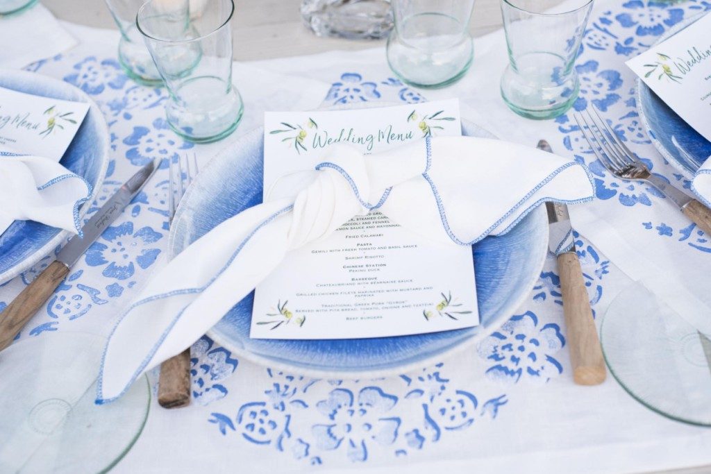White linen napkin with blue stitching - Image 1